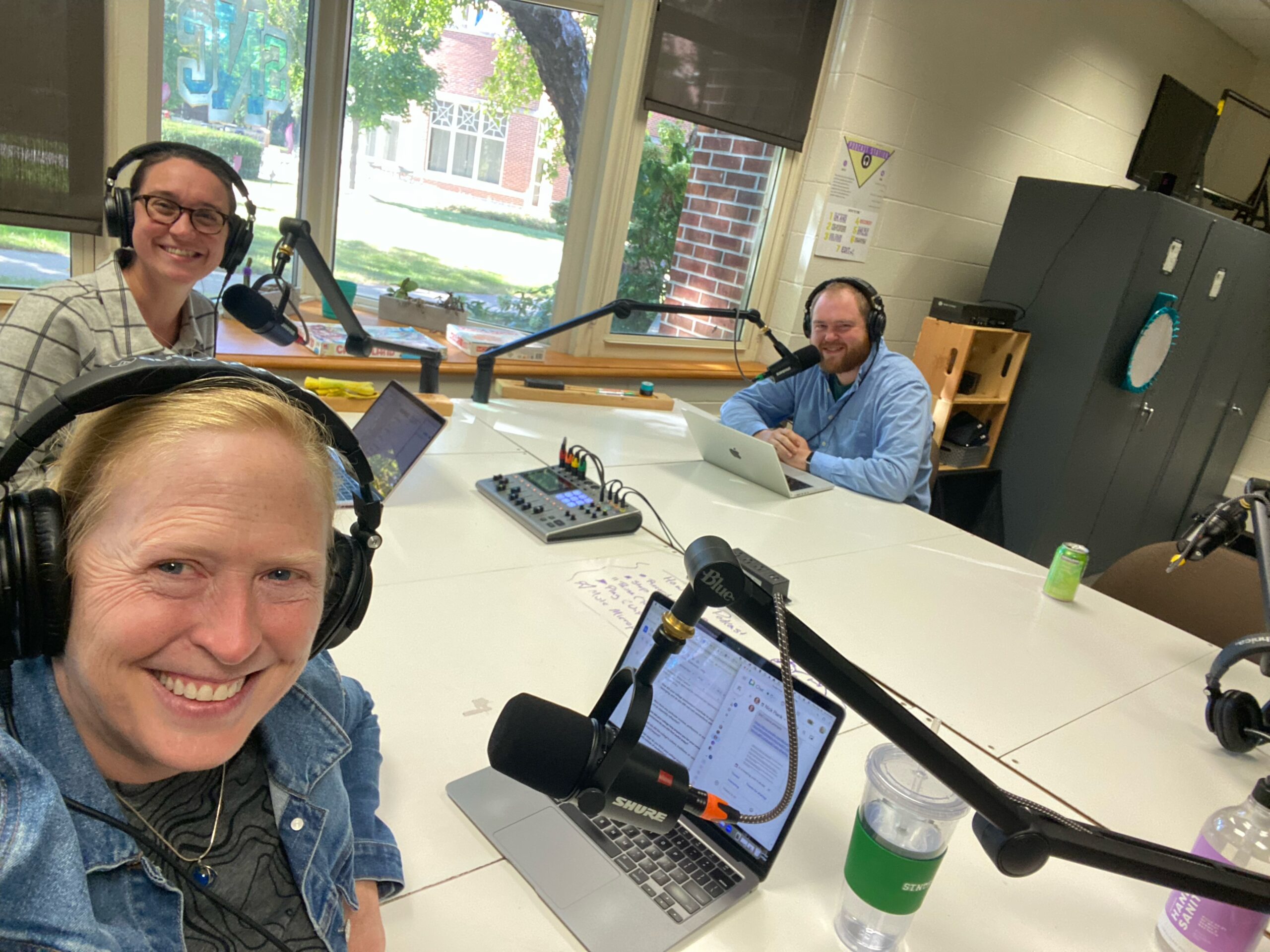 Three people recording a podcast